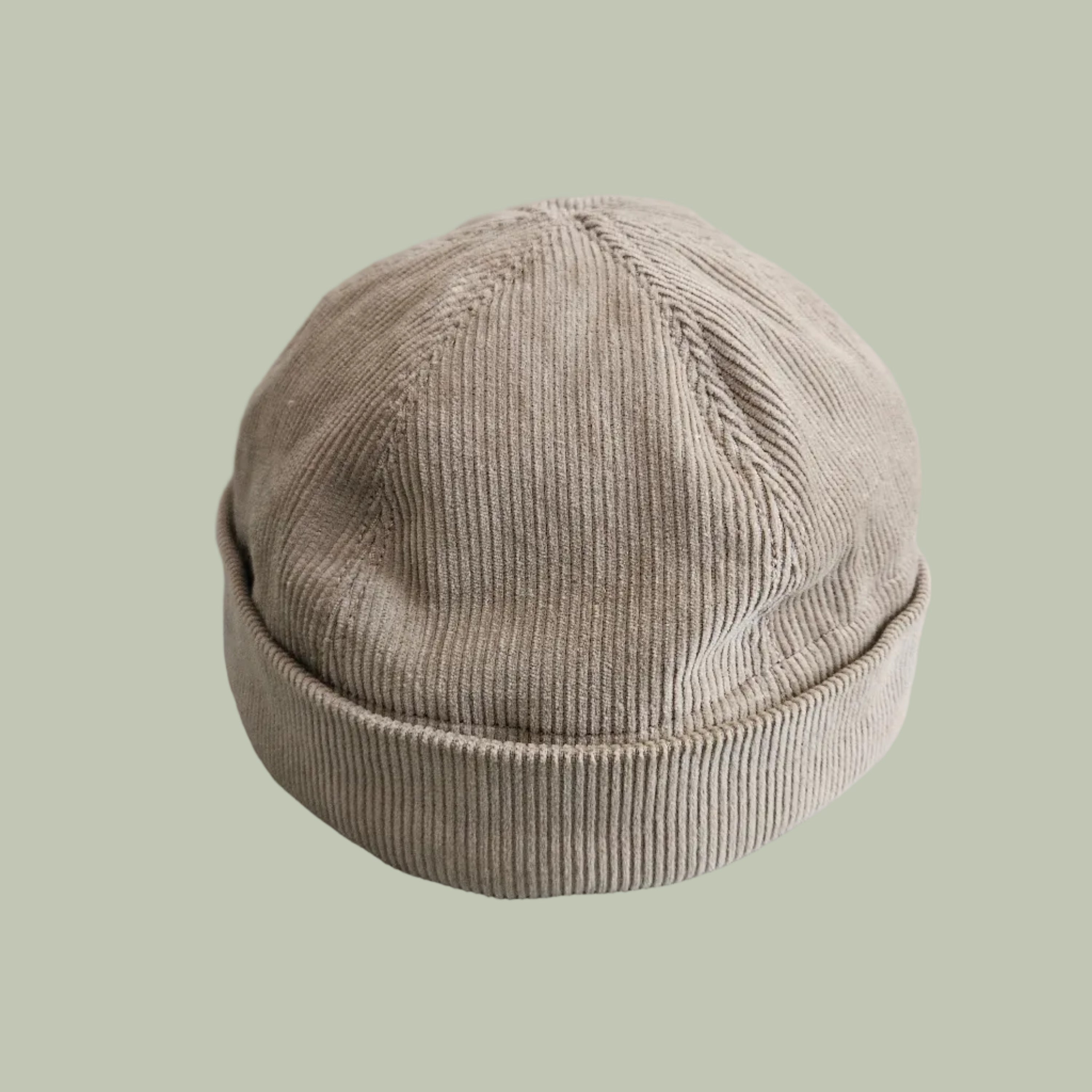 A beige corduroy brimless hat