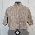 Front view of beige gingham button-up shirt