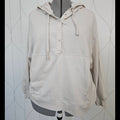 Front view of beige hoodie with snaps