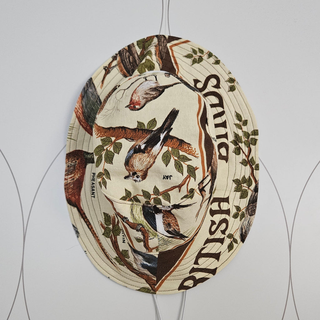 A vintage bird print bucket hat with a drawstring