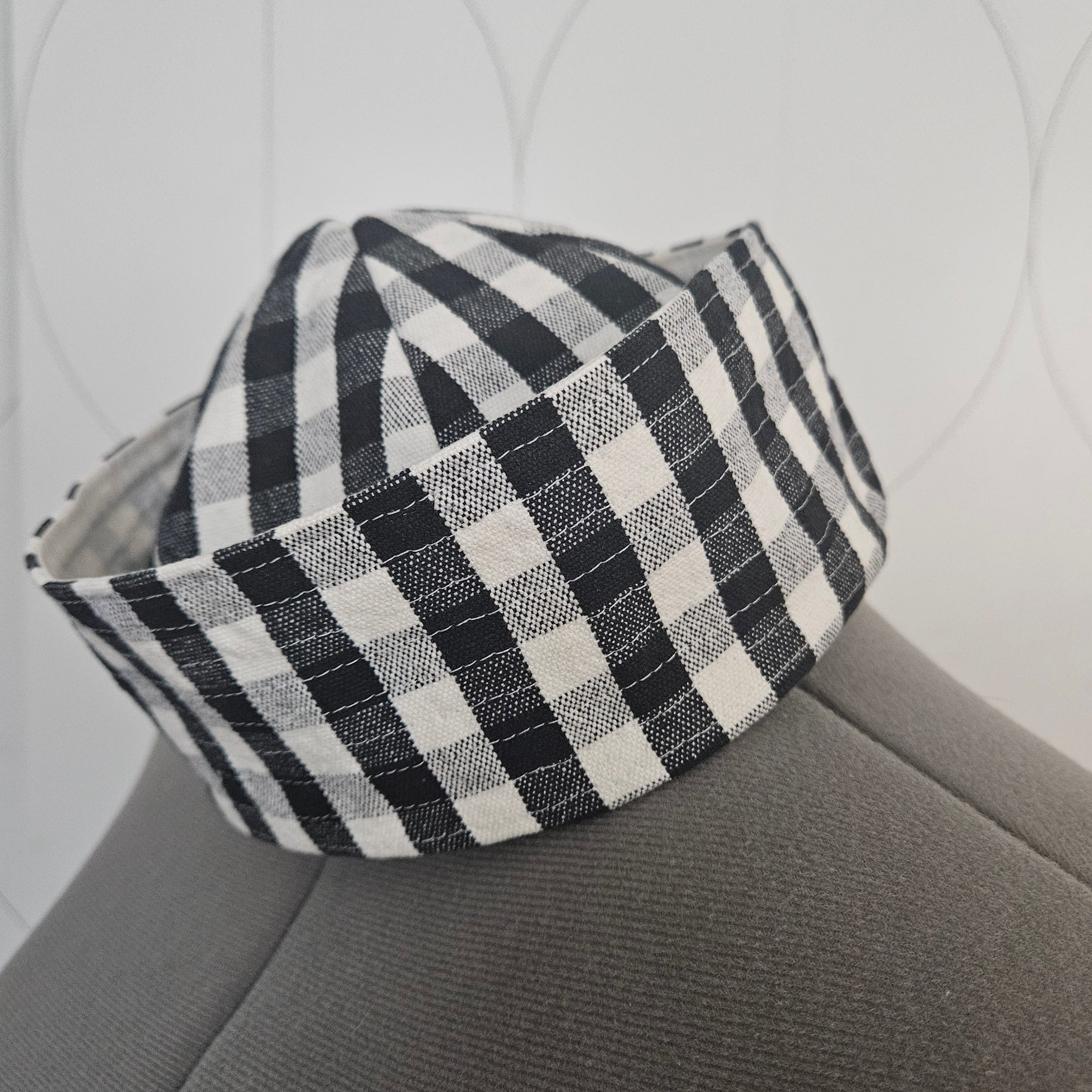 Side of black and white gingham sailor hat on dress form