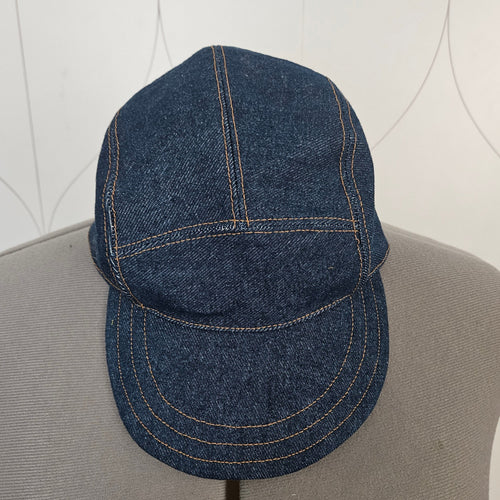Front view of a denim camp hat
