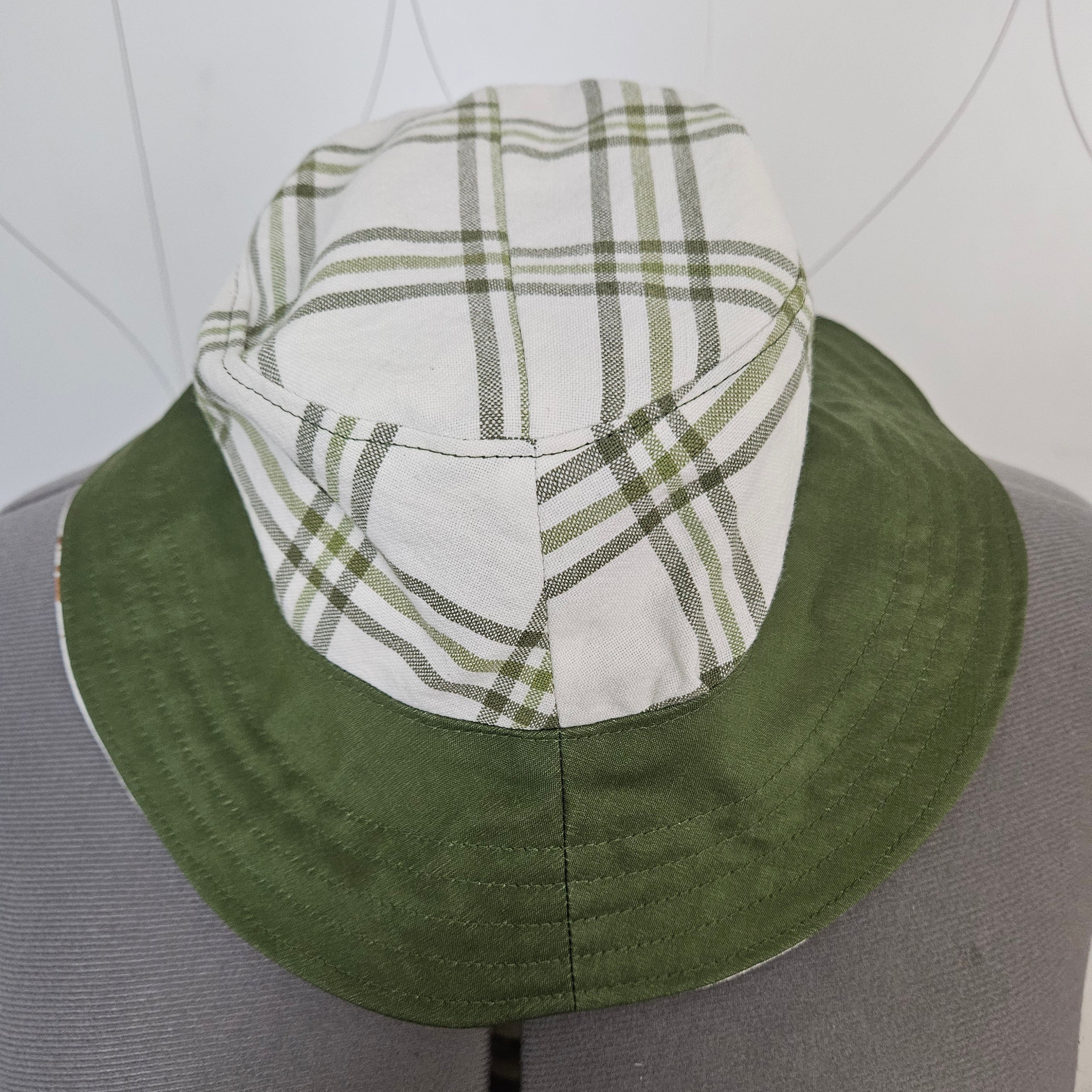 Front view of green and white plaid bucket hat