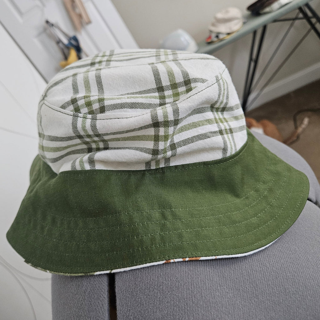 Side view of green and white plaid bucket hat