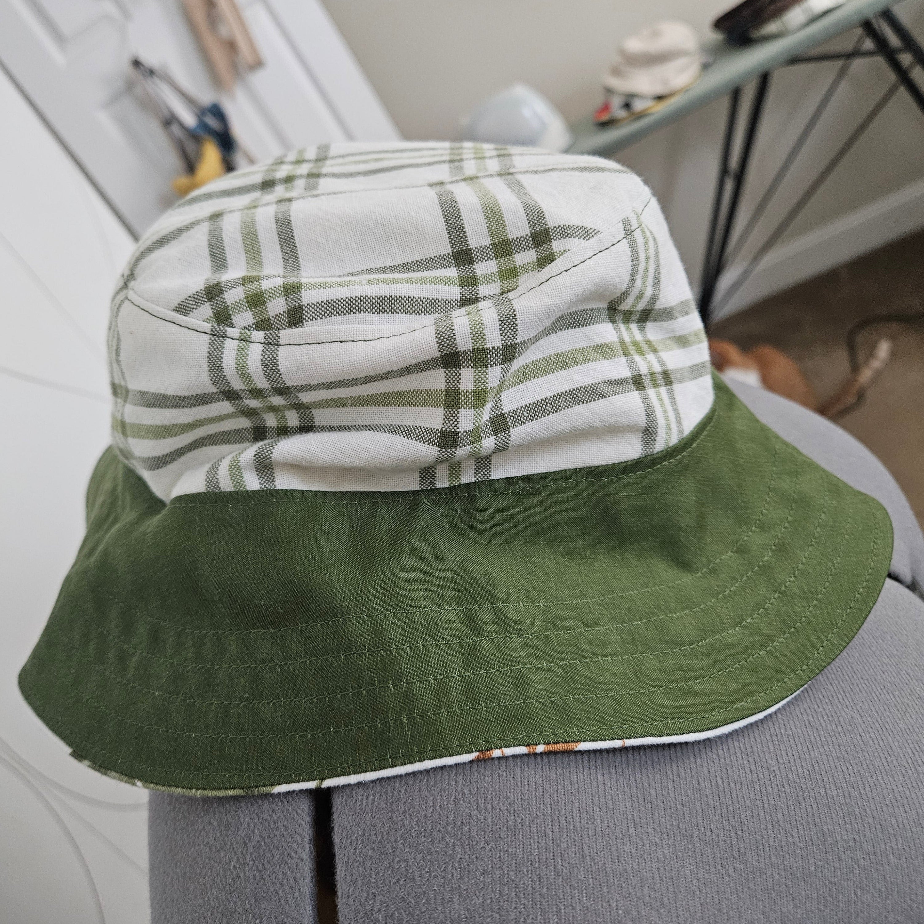 Side view of green and white plaid bucket hat