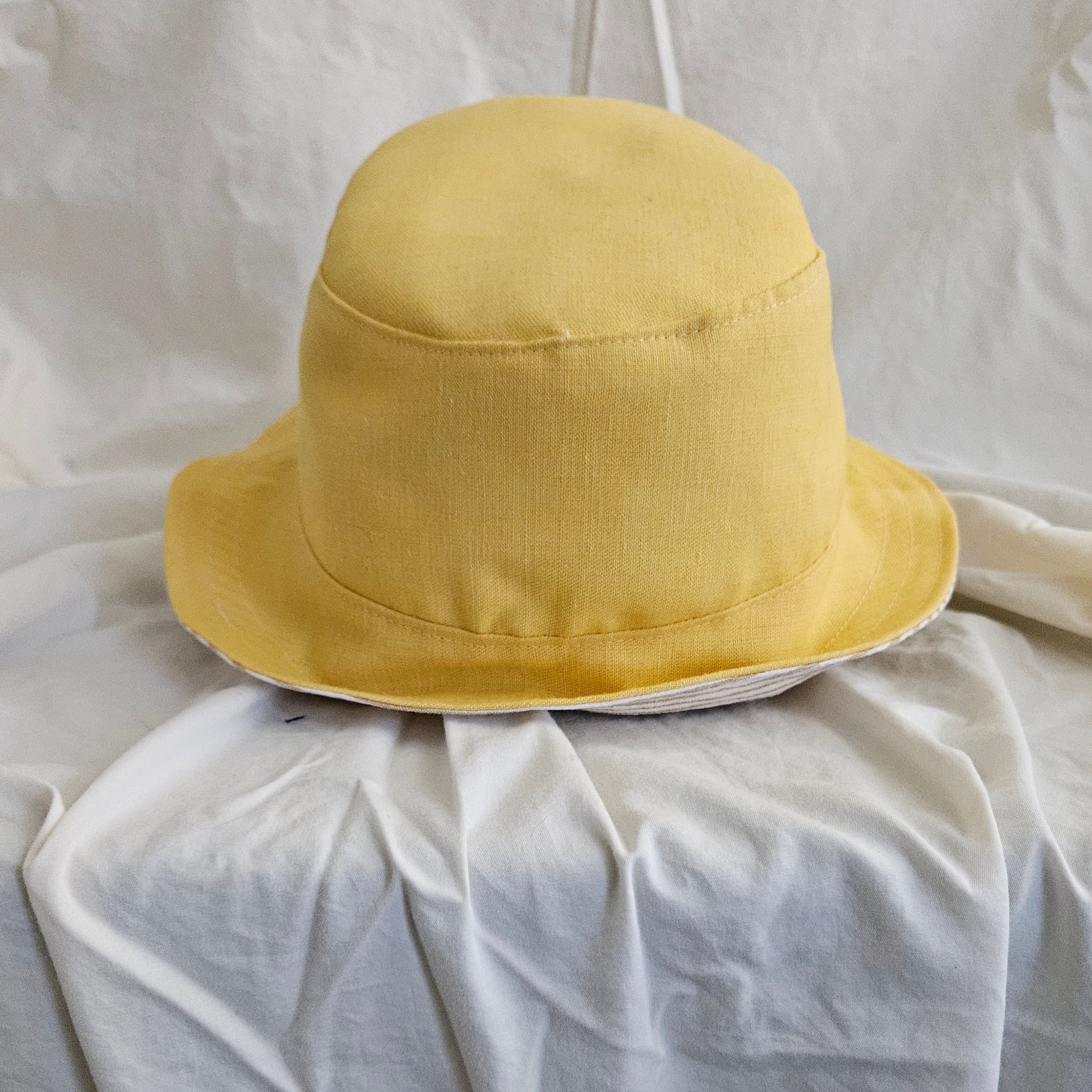 Yellow bucket hat on a white background
