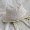 Striped bucket hat on a white fabric background